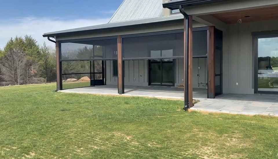 Retractable screen installed on outdoor patio