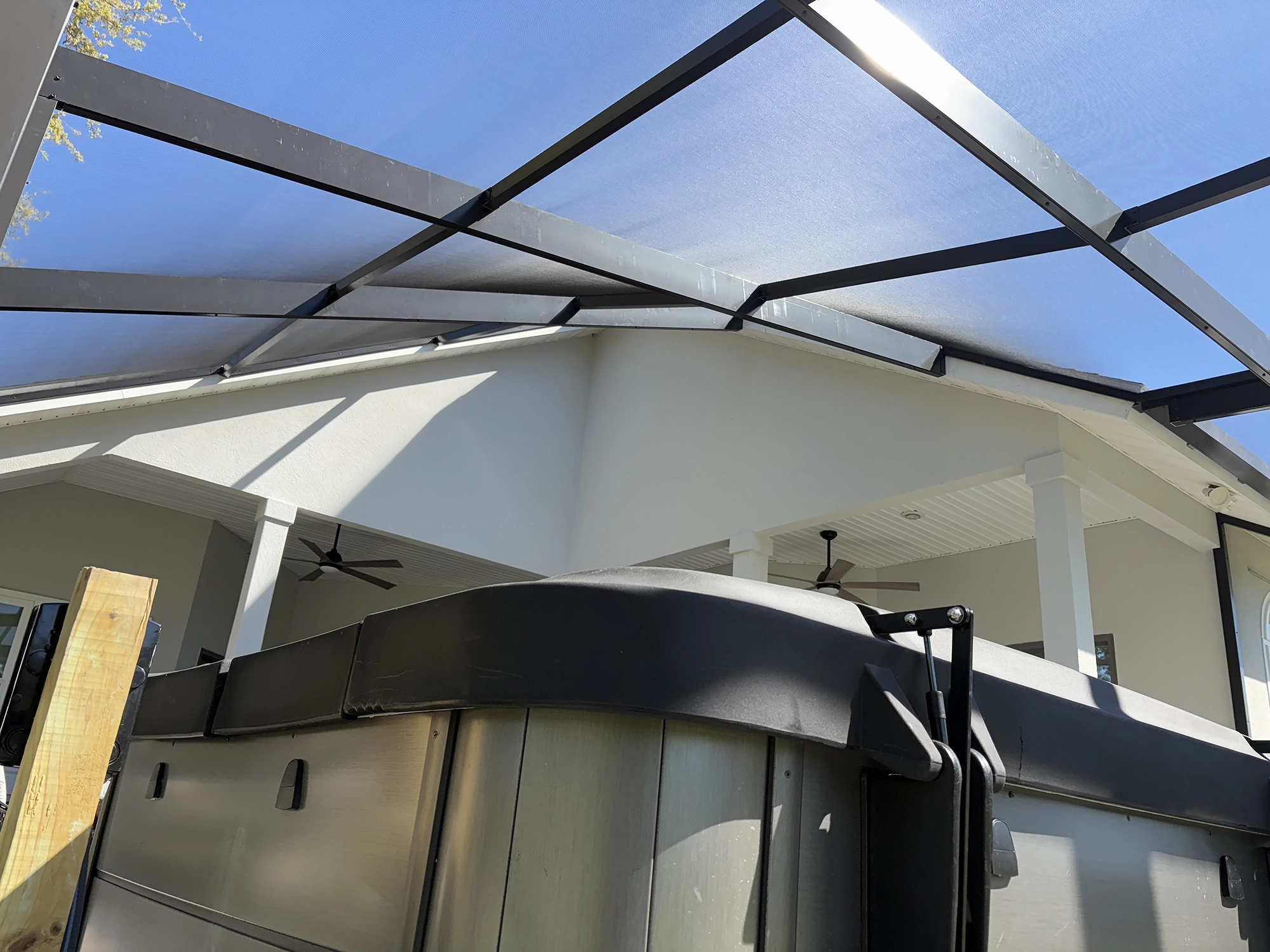 Pol enclosure on patio with hot tub